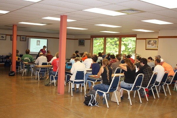 people in rows of chairs in one of the meeting rooms