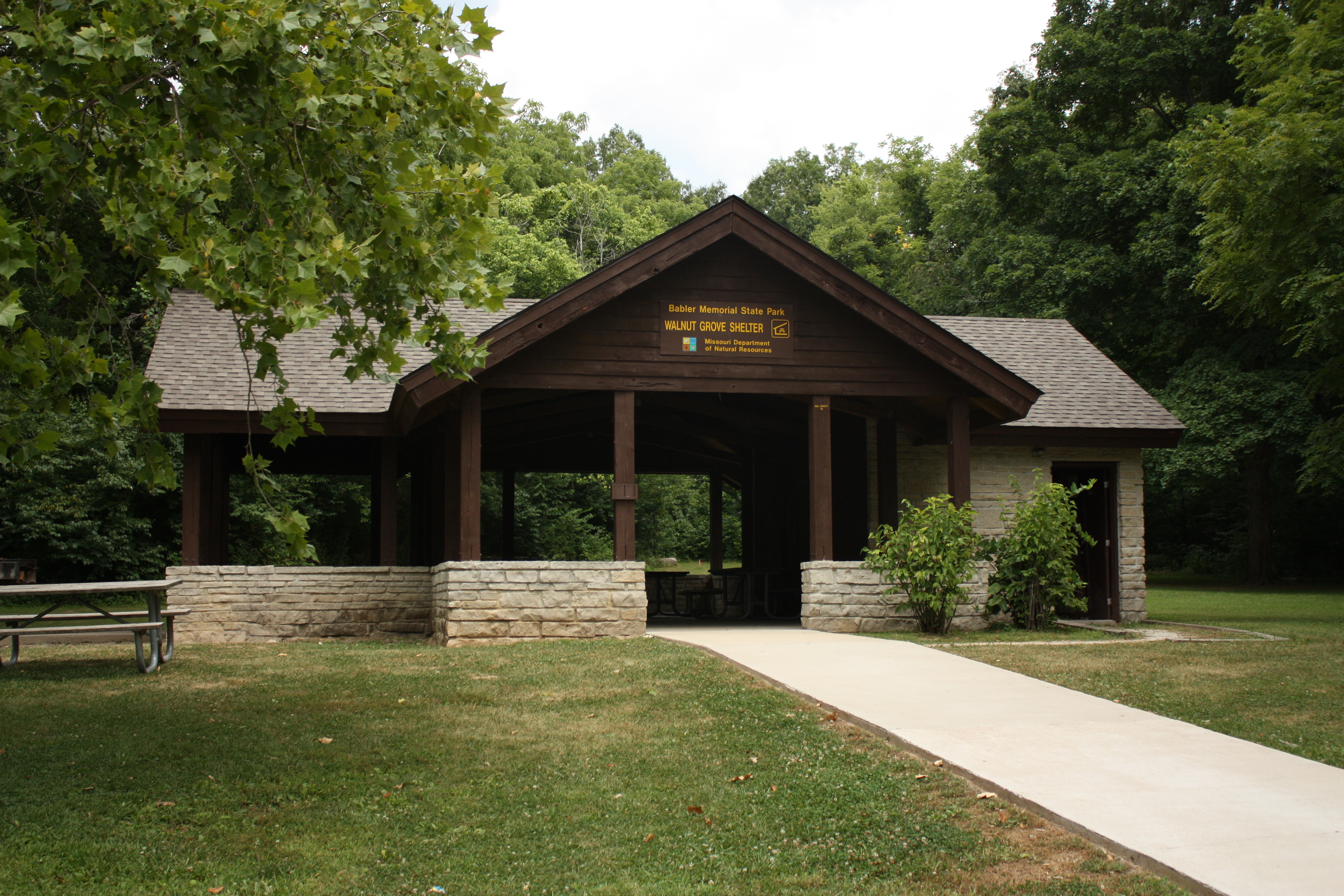 Exterior of the pavilion-style shelter with a wooden facade