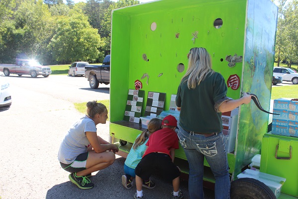 kids looking at an interpretive display at a special event