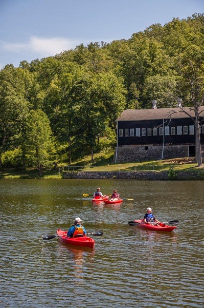 people kayaking on the lake