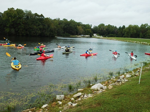 numerous people in kayaks on the lake