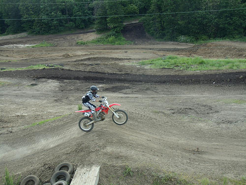 a person airborne on a dirt bike 