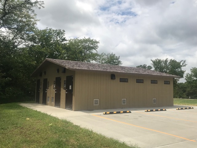 exterior of showerhouse showing four shower doors