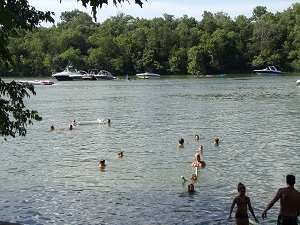people swimming in the lake