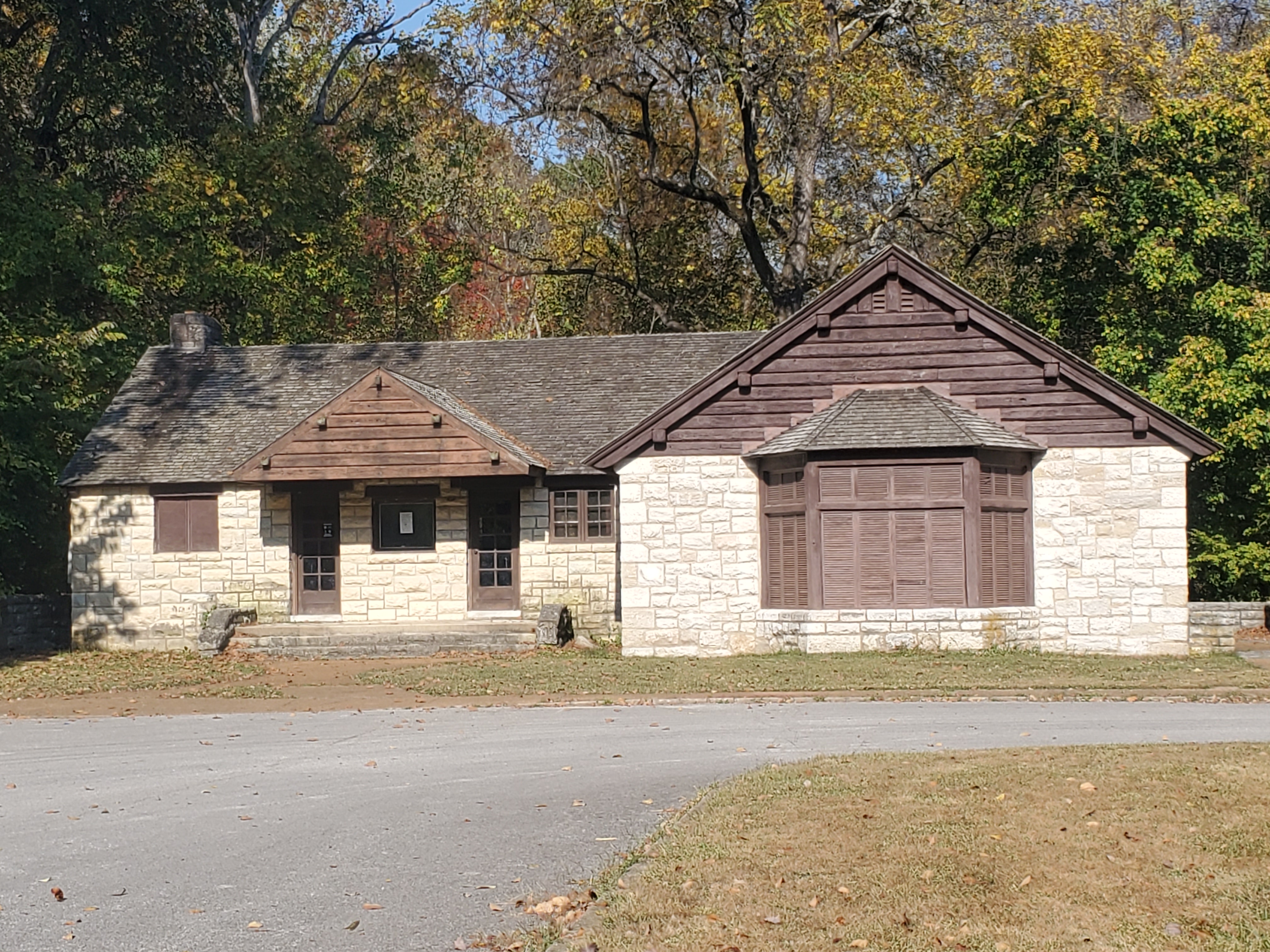 The front exterior of the stone and wood enclosed shelter