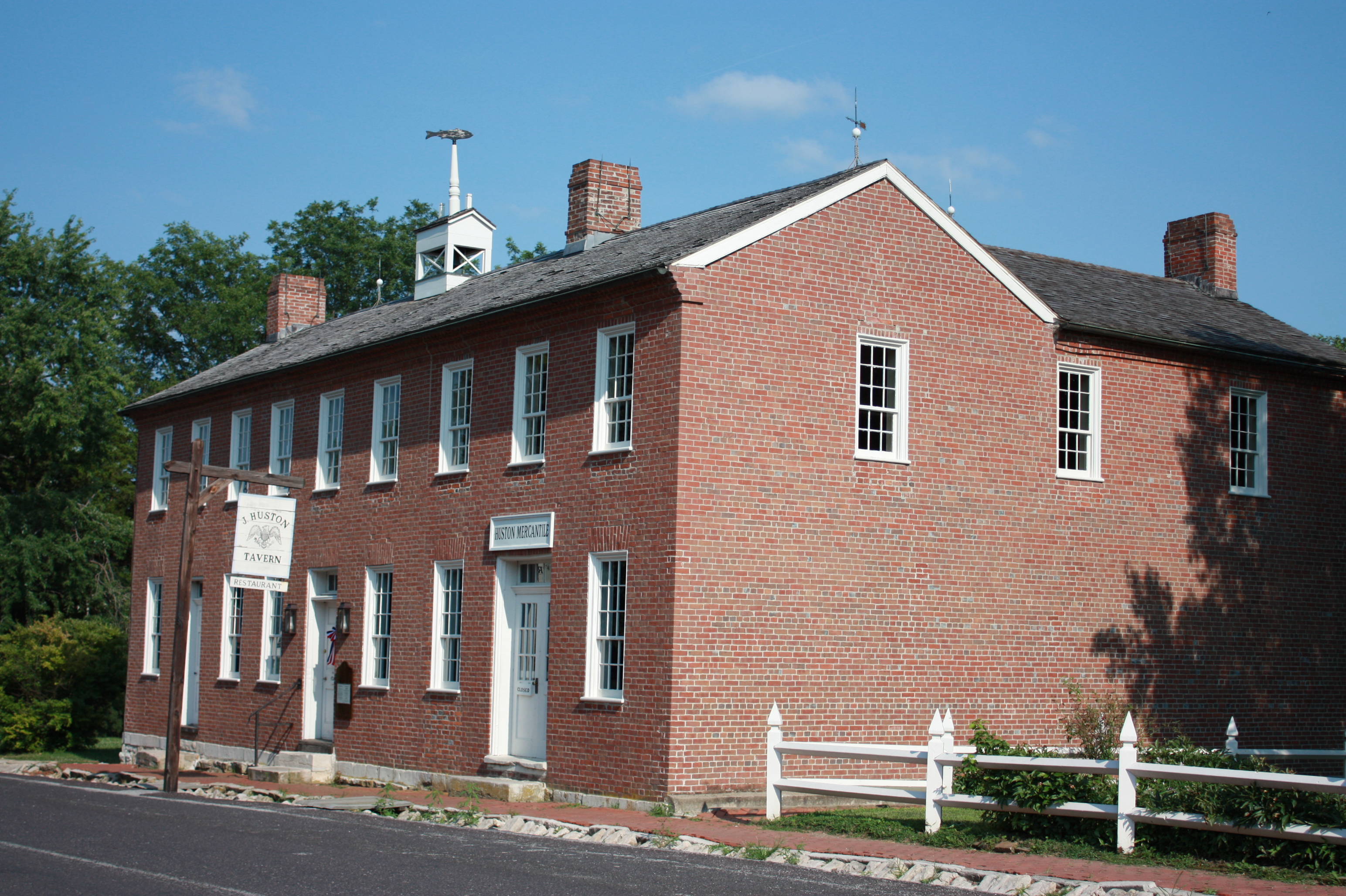 Exterior of red brick, two-story J Huston Tavern