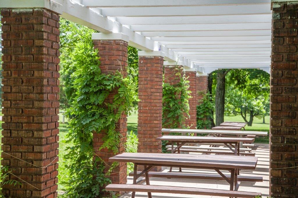 picnic tables inside the pergola