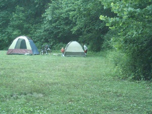 two tents set up in a grassy field