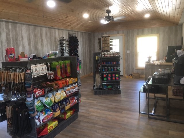 Snacks and merchandise on racks inside the store.