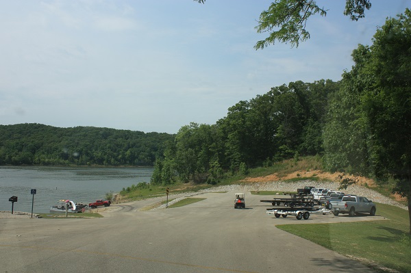 trucks with boat trailors parked across from the boat ramp