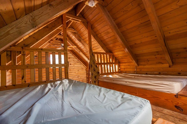 two beds inside a cabin