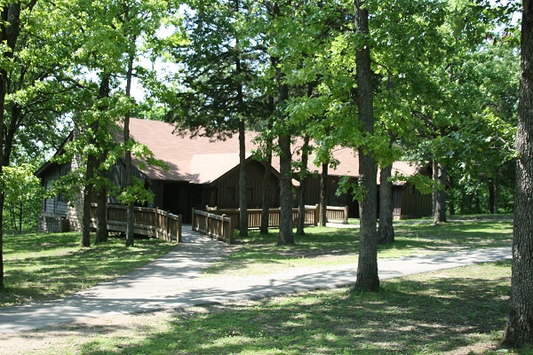 Exterior of dining lodge under large shade trees