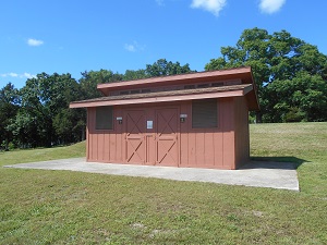 exterior of beach house with two doors to changing rooms