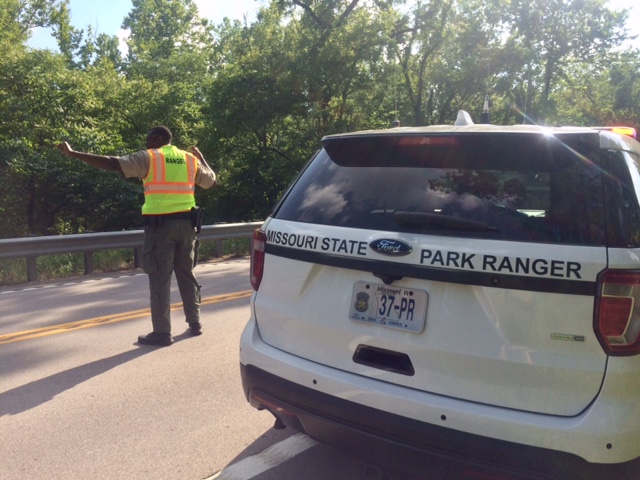 a ranger directing traffic