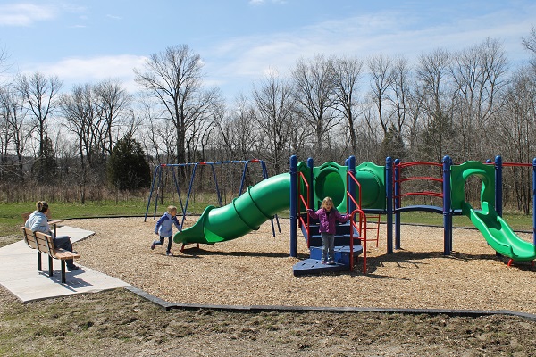 Kids playing on playground equipment