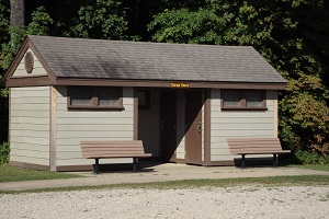 exterior of change house with two benches in front