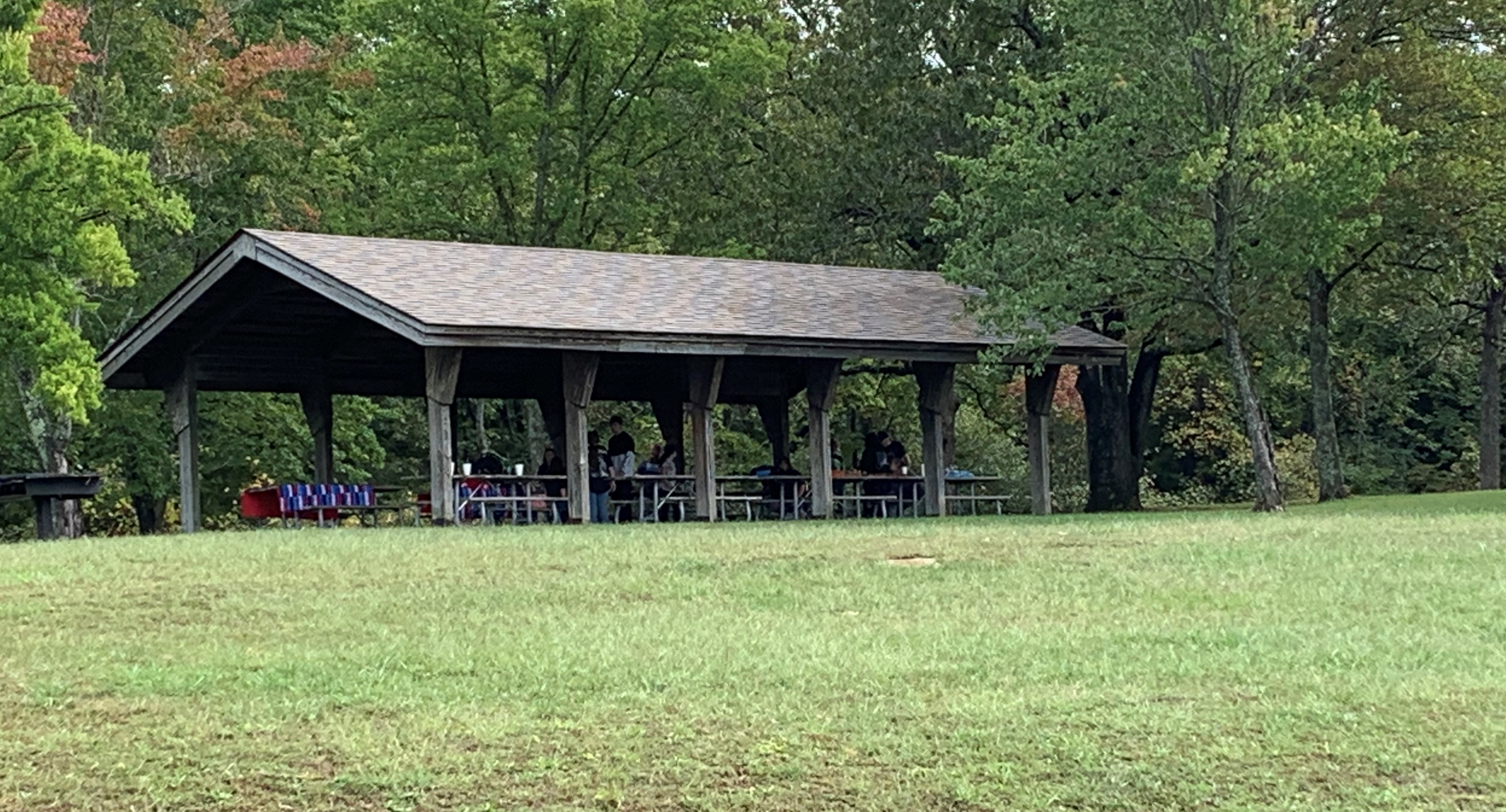 Park visitors have a picnic at the open shelter