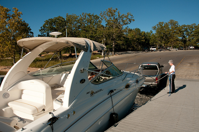 truck backing boat onto boat ramp