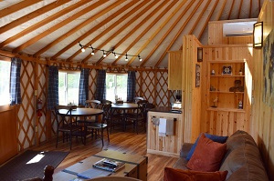 tables and kitchenette area of the yurt