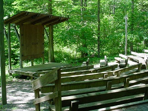 wooden benches and the stage at the amphitheater