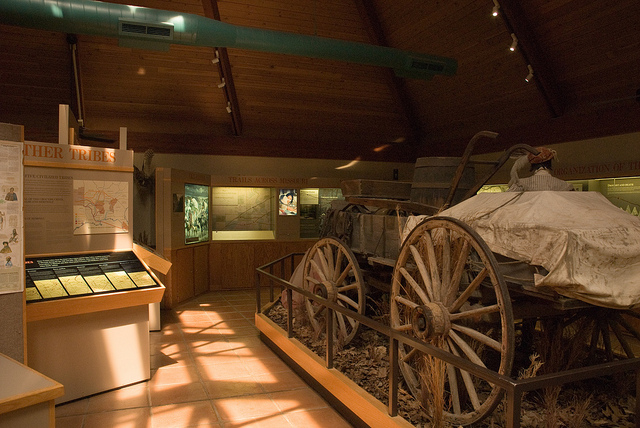 an old wagon on display in the visitor center