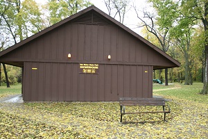 exterior of showerhouse with bench outside