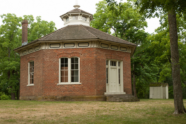 octagon-shaped, red brick school building