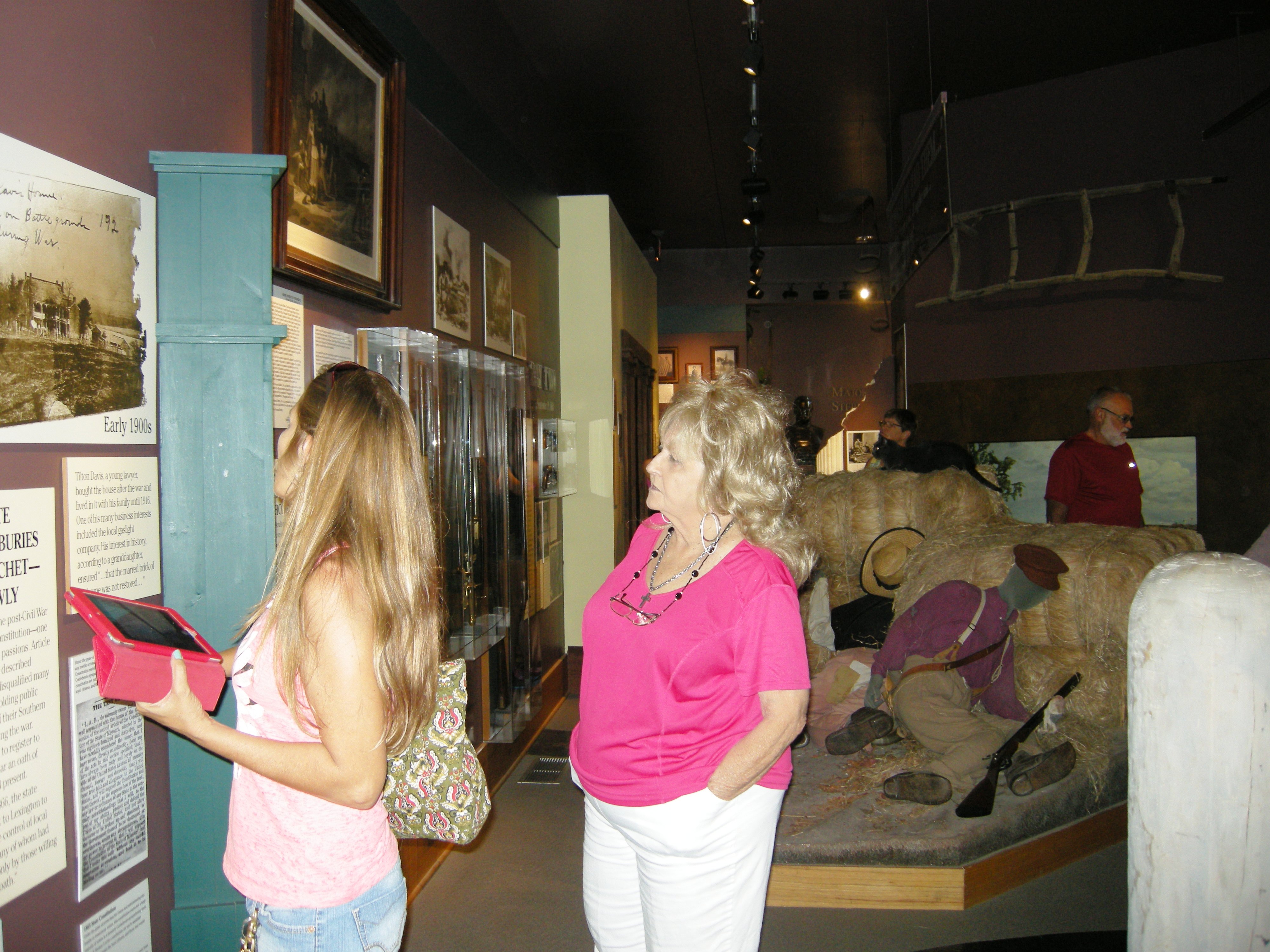 people tooking at exhibits in the visitor center