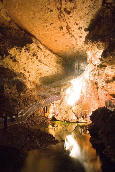 the path with railing winding down through the cave