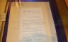 A contract in a display case