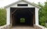 Entrance to a white covered bridge