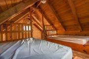 two beds inside a cabin