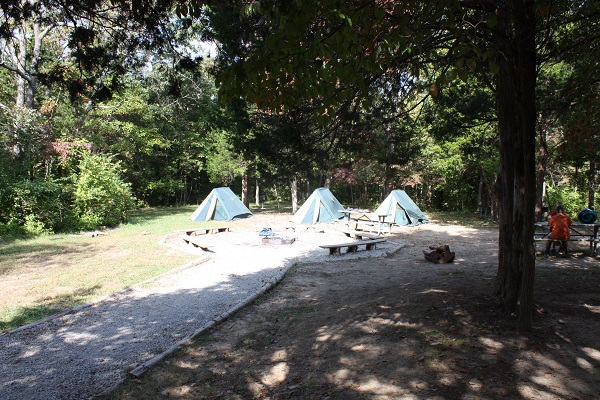 Tents set up near the group fire ring