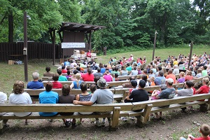 people sitting in the amphitheater during a program