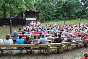 people sitting in the amphitheater during a program