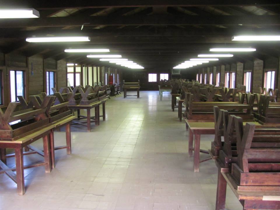 tables and benches inside dining hall