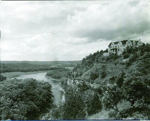historic photo of castle on top of bluff overlooking the lake