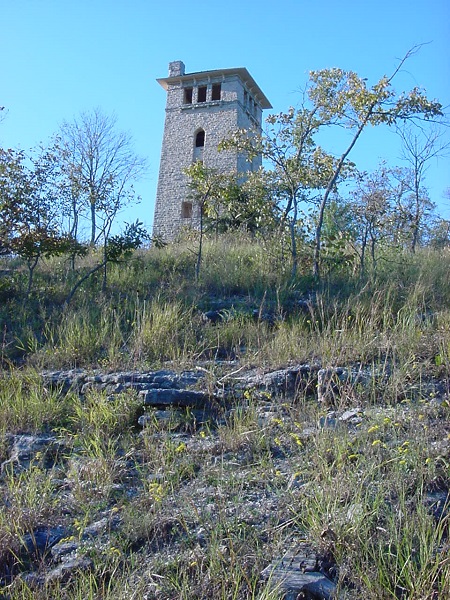 rock water tower ruins on top of a hill
