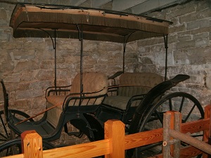 old carriage on display inside the Lohman Building