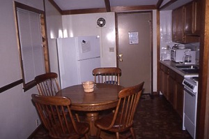 dining table and kitchen inside a cabin