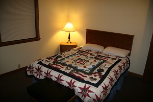 queen size bed inside a cabin