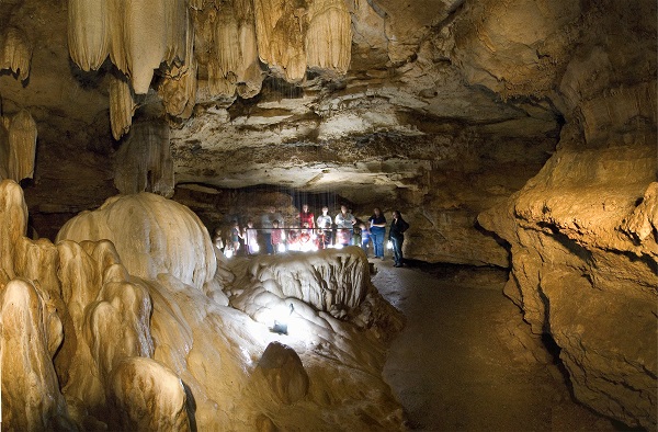 inside of Ozark Caverns with a group touring in the distance