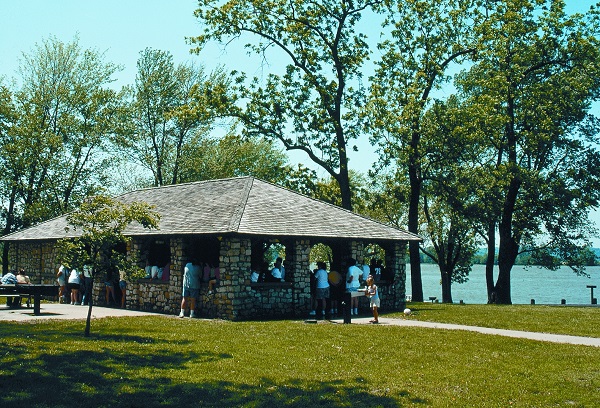 a group using the rock shelter, which sits next to the lake