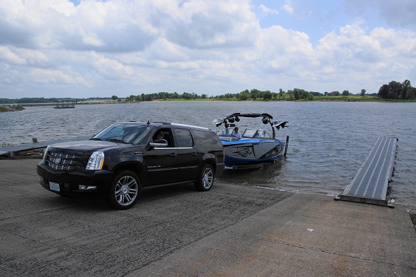 a boat being backed into the water at the boat ramp