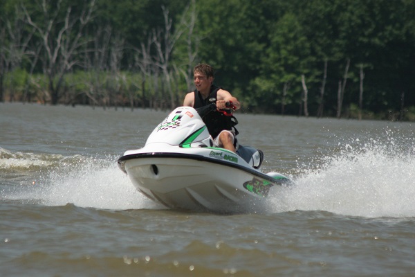 a man riding a personal watercraft on the lake