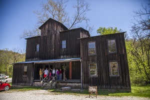 people on the porch of the mill