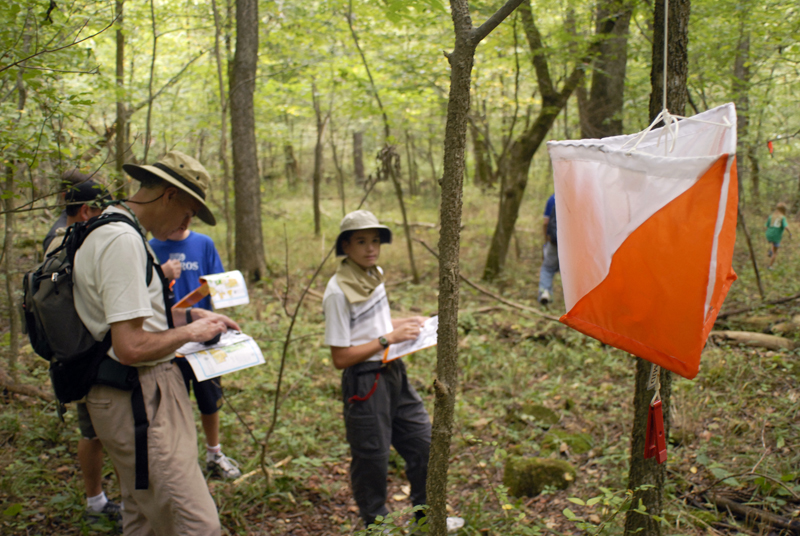 Group of people recording a point on an orienteering course