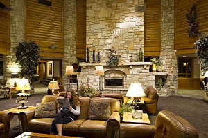 Large rock fireplace and rustic decor of interior of the lodge