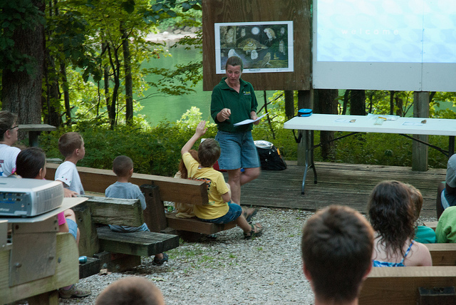 a naturalist presents a program in the amphitheater