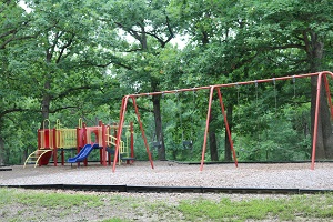 playground equipment with a slide and a swing set